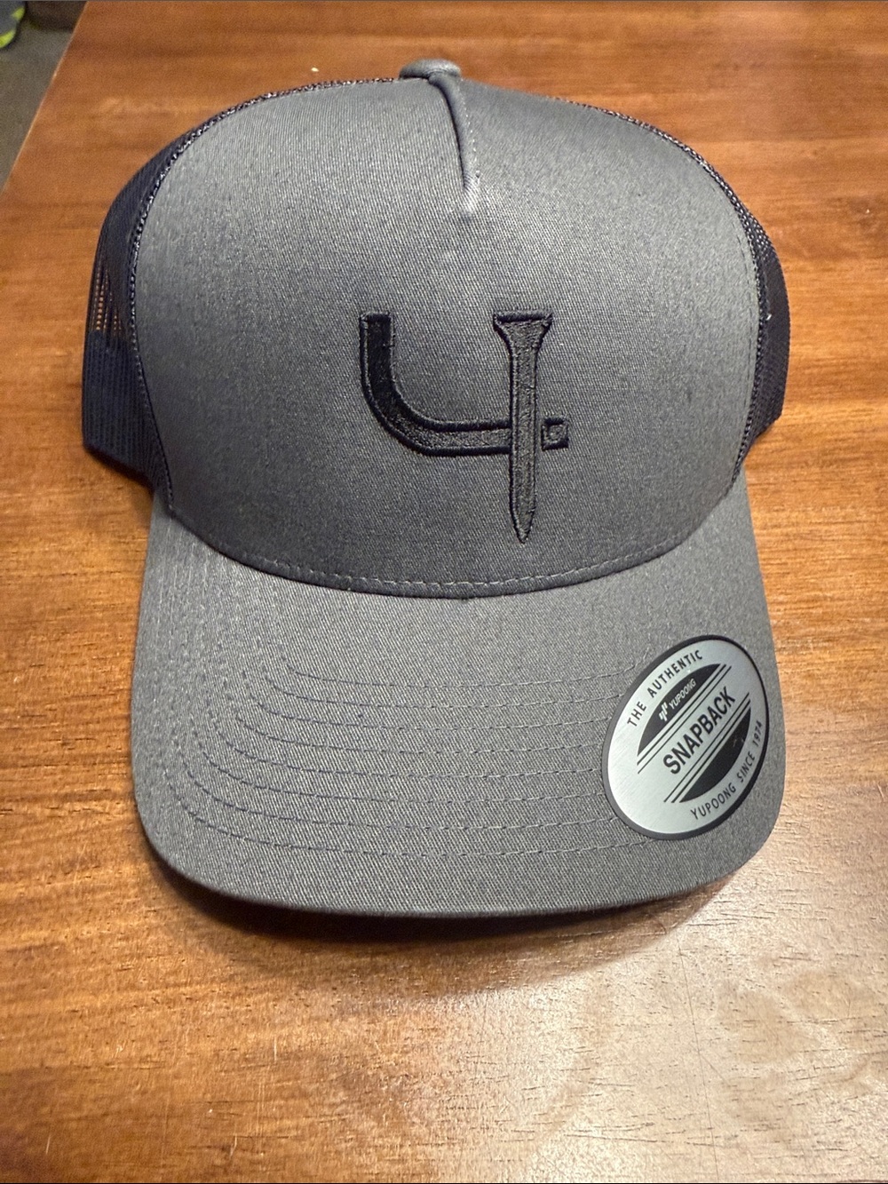 Gray Snapback Trucker Hat with Black Embroidered Logo